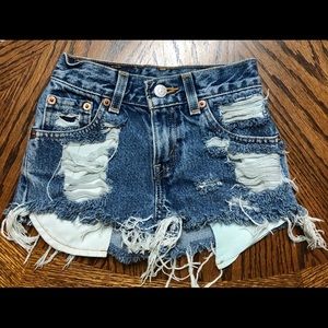 Distressed Levi’s blue jean shorts